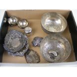 Two white metal eastern bowls together with two silver bottle labels, three silver pin trays,