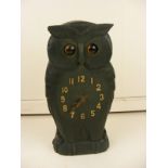 A carved wooden Owl clock with moving eyes