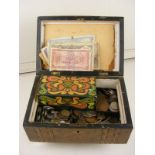 An antique workbox including a large quantity of world coinage to include some notes