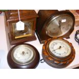 Two mantle clocks together with two wall barometers