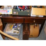 A mahogany two drawer side table