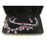 A 925 Silver real Ruby & Marcasite 3 piece set comprising of earrings,