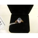 A 9K Blue topaz and diamond ring