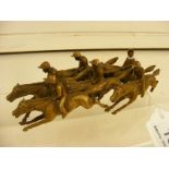 A Bronze? well sculptured pack of race horses and riders (examine: one leg missing at front)