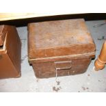 A vintage tin travelling trunk together with a quantity of stuffed toys and linen