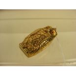 A brass novelty owl sovereign case