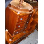 A Yew wood reproduction chest of drawers together with a TV cabinet occasional table