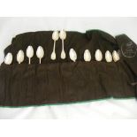 A set of 12 Christofle spoons in original cloth holder