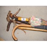 A selection of vintage umbrella's and walking sticks