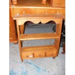 A vintage pine hanging shelves with three small drawers fitted