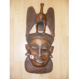 A Tribal Interest carved face mask