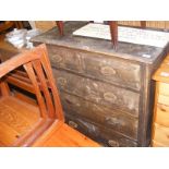 A Victorian chest of drawers in weathered condition