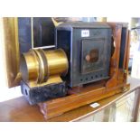 A wood and brass magic lantern made by Record England