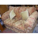 A modern three seater and two seater settee in floral decoration