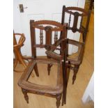 Two nicely carved chairs in need of seats together with a folding sewing stand
