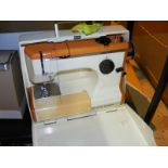 A Frister and Rossmman cased retro sewing machine