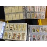 Seven albums of cigarette cards including HD & WO WIlls, John Player, Ogdens, Gallaghers,