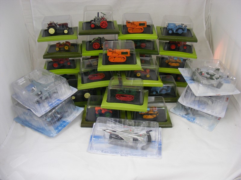 25 boxed Hachette tractors together with six diecast planes