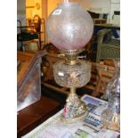 An Antique Oil lamp with cast brass base in the form of a lion with enamelled/painted Great Britain