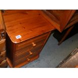 A Pine dressing table with fitted three drawers to the left