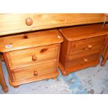 A Pair of pine two drawer bedside cabinets