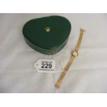 A ladies 9ct tri gold Rolex Watch in Rolex case