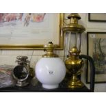 A selection of Oil lamps and lanterns to include Large brass and engraved glass candle lamp