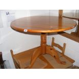 A Circular pine kitchen table