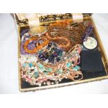 A quantity of costume jewellery to include amber necklace etc