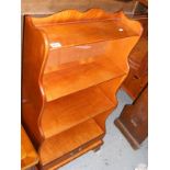 A Yew wood waterfall bookcase
