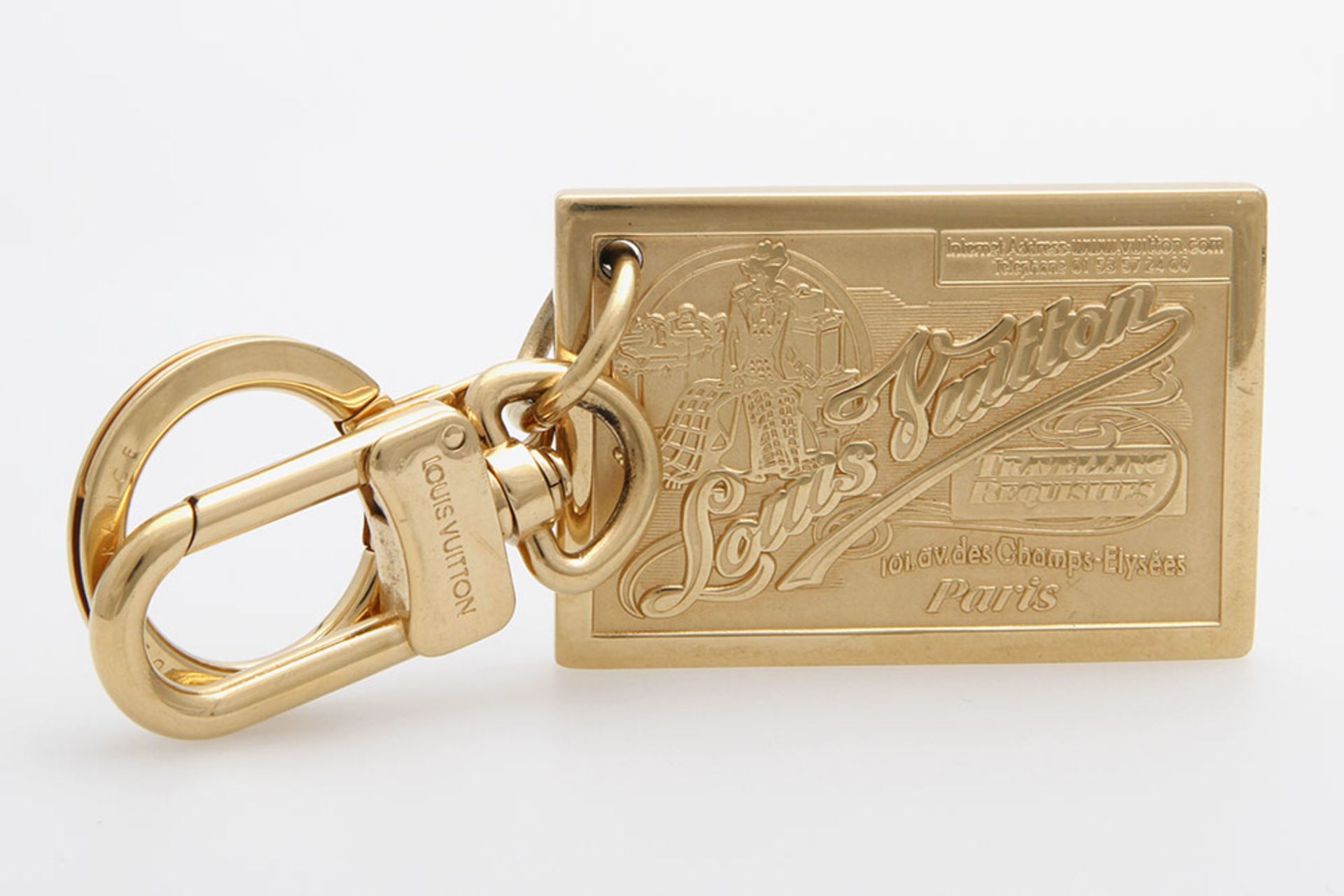 LOUIS VUITTON " Travelling Requisite" hübscher Schlüsselanhänger. Schwere goldfarb. Plakette mit