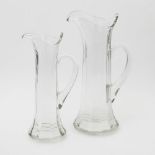 Paar Henkelkaraffen, Glas, 20. Jh. H. ca. 24/ 27 cm, entsprechende Alters- und Gebrauchsspuren.