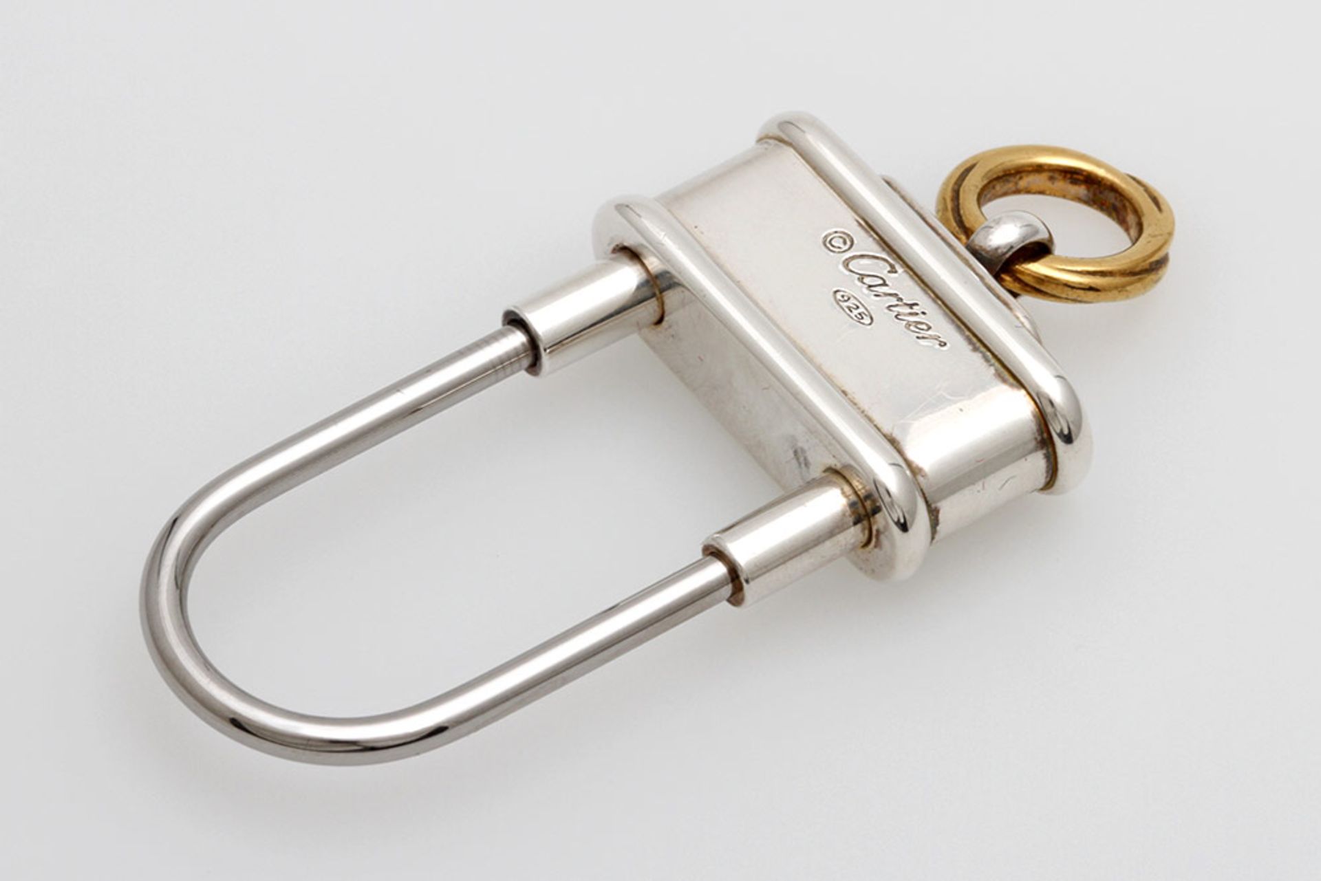 CARTIER Schlüsselanhänger "Decor 3 anneaux" in Form eines Vorhängeschlosses. Silber, Bügel aus
