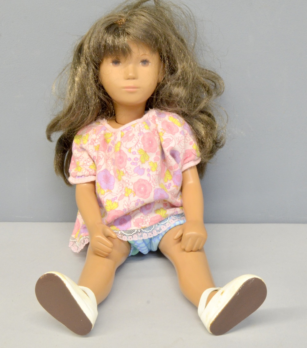 'Sasha' doll with tanned body and brunette wig,