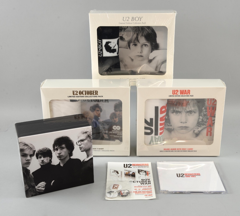 U2 Promotional items including, the first 3 albums remastered in presentation boxes with t shirts,