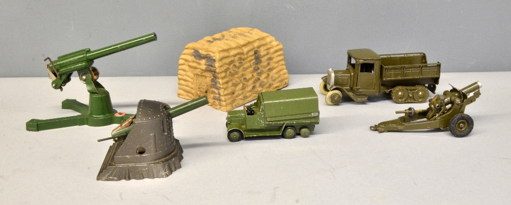 Britains' Army truck with camouflage cover, Dinky army truck, and Britains' gun and two Astra guns