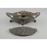 Art Nouveau pewter, a tray with design of a child and a snail in relief, 27 cm and a tapering oval