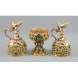 Three pieces of Zsolnay Pecs to include a pair of ewer shaped vases, pierced design with Persian