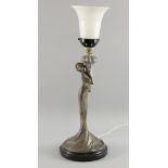An Art Nouveau style figural white metal table lamp with white glass shade, total height 48cm