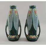 Art Nouveau, pair of twin handled vases with raised decoration in the secessionist style, both