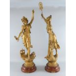 A pair of large French spelter figures representing L'electricite and La Vapeur,, gold painted on