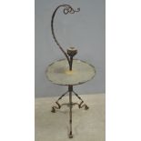 A  wrought iron and copper kettle stand, the hammered copper tray with leaf design in star