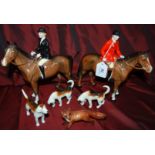 Beswick man on horse, woman on horse, boy/girl on horses. 8 hounds & 1 fox.