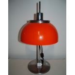 1970's Harvey Guzzini chrome plated table lamp with orange plastic adjustable shade made in Italy.