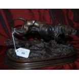 Bronze effect hunting hound signed E. Delabrierre (30cm x 16cm).