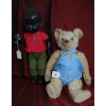 Vintage Steiff teddy bear & a plastic black doll by Pedigree toys.