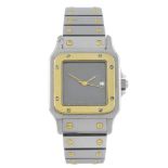CARTIER - a Santos bracelet watch. Stainless steel case with yellow metal bezel. Numbered 296159725.