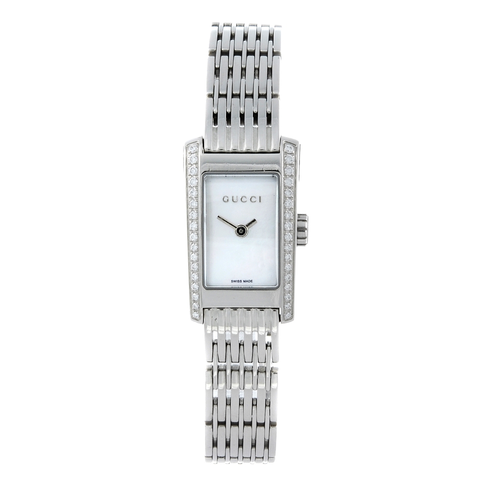 GUCCI - a lady's 8600L bracelet watch. Factory diamond set stainless steel case. Numbered 15178.