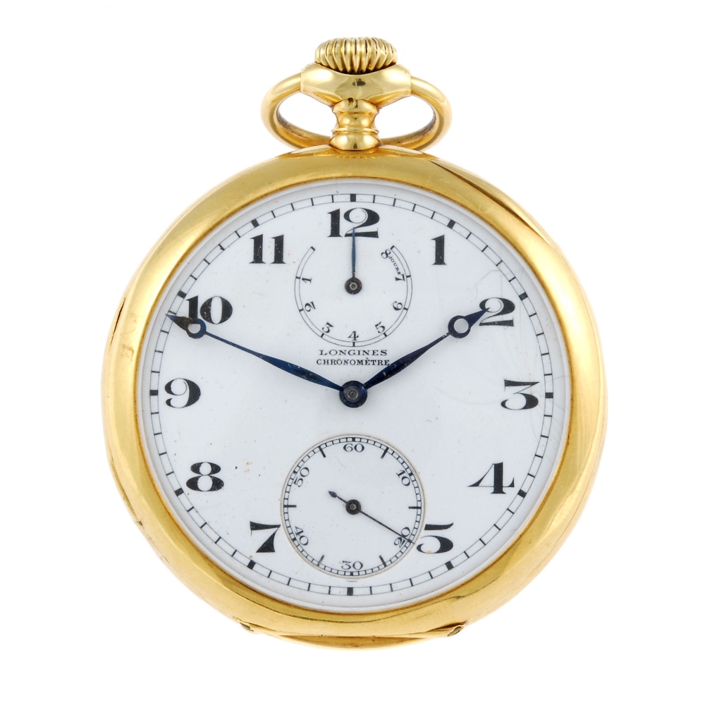 An open face eight day chronometer pocket watch by Longines. Yellow metal case, stamped 18k with