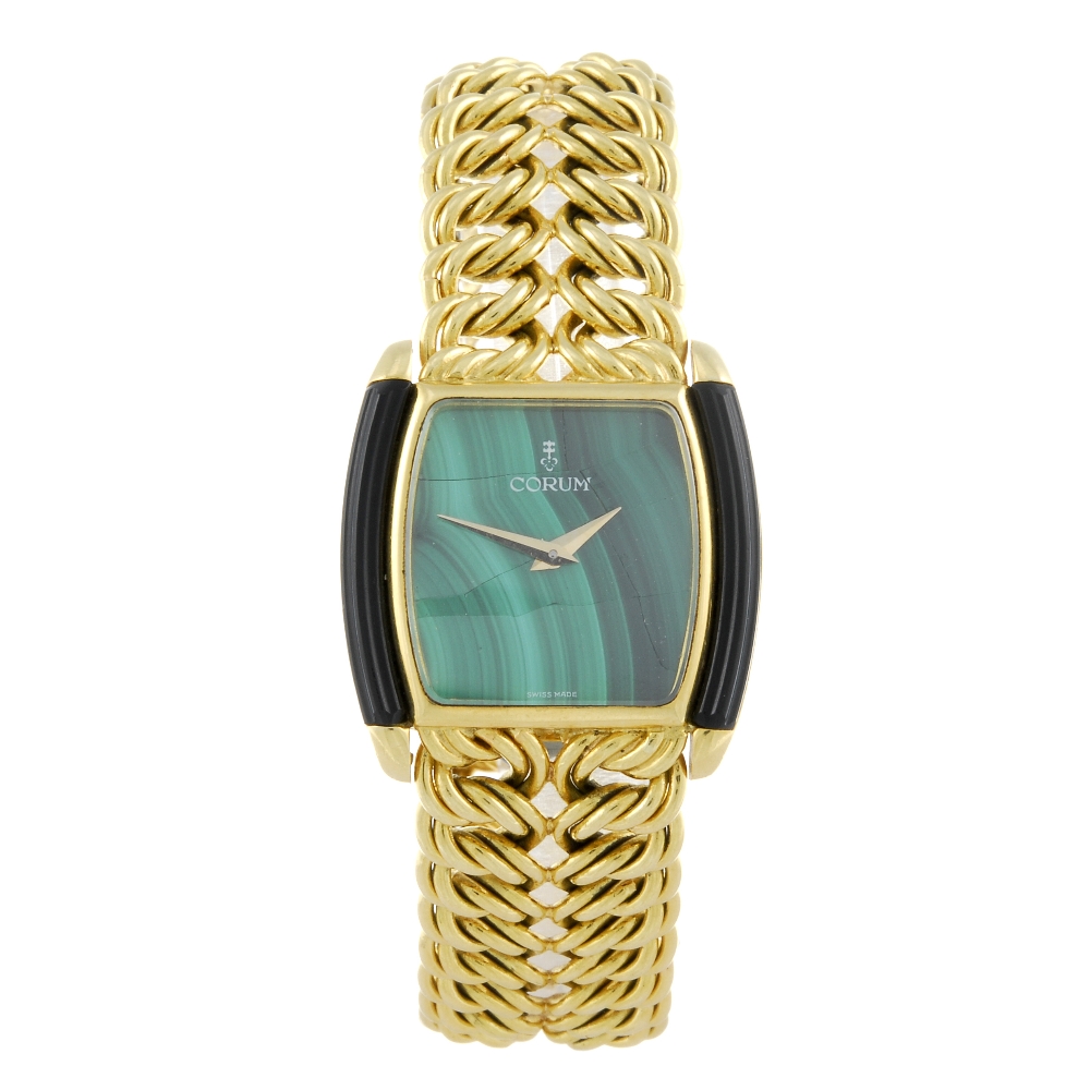 CORUM - a lady's bracelet watch. Yellow metal case, stamped 18k with poincon. Numbered 27630N48
